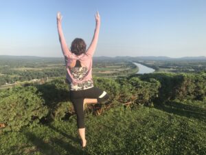 Lauren doing Yoga on a mountain